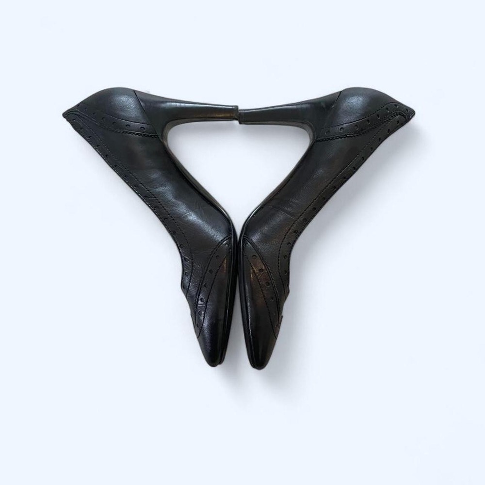 Black leather wingtip heels size 8.5 by Coach and four